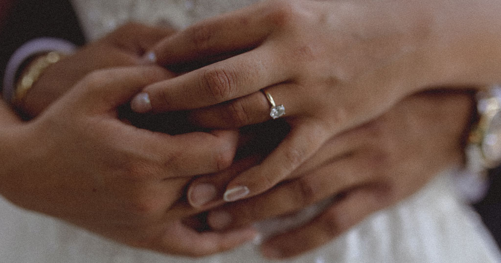 Picture of wedding ring on bride's hand